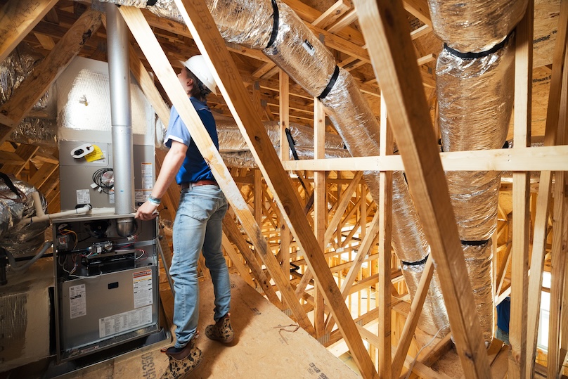 Men looking at a new furnace installation